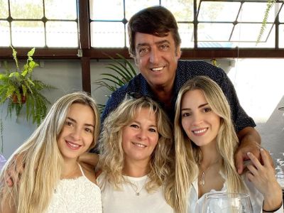 Christina, Alejandra, and Ornella Invernizzi are sitting whereas father is standing behind them in the picture.